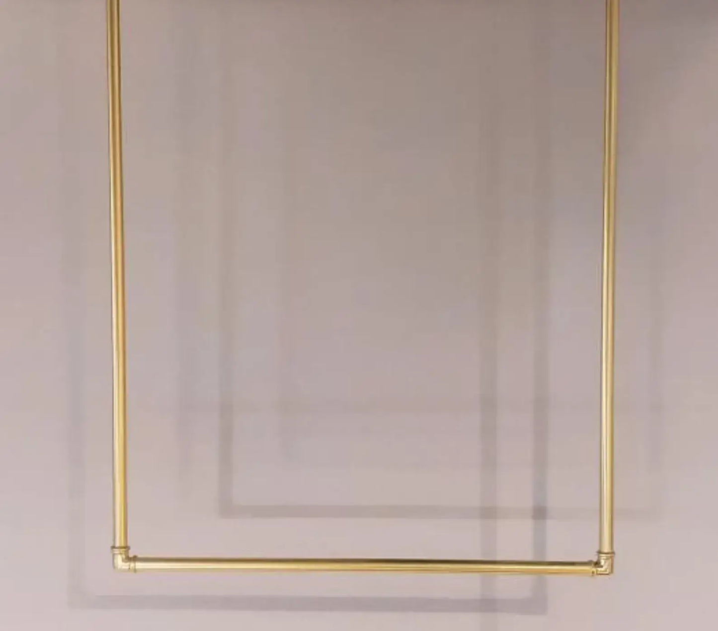 unlacquered brass hanger rack architectural styling