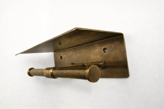 brass toilet holder with shelf close up