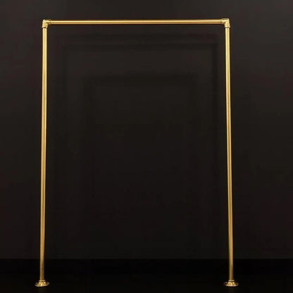 floor mounted brass clothes rack modern interior