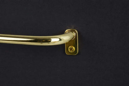 french return brass curtain rod close up