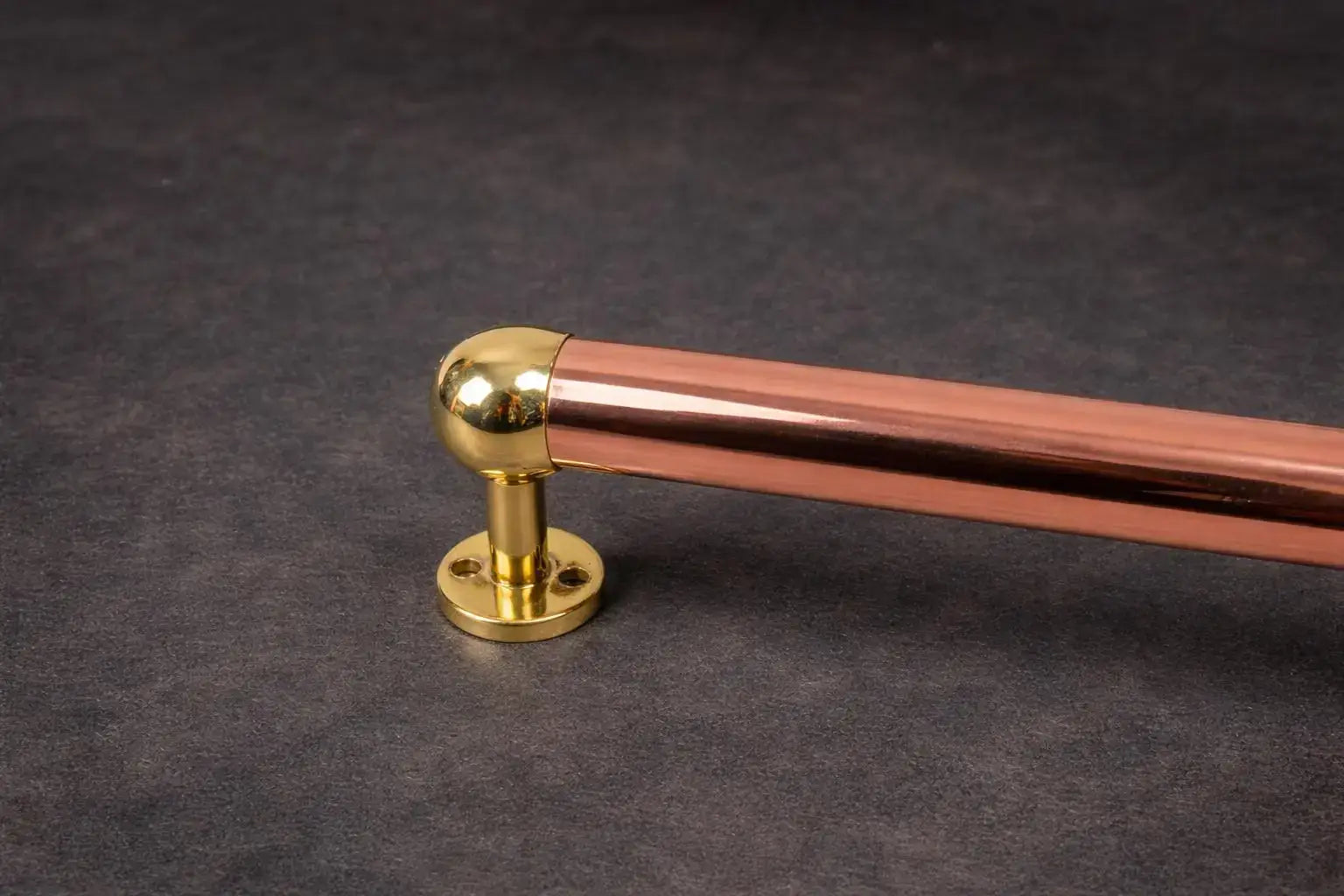 copper and brass towel rail detail