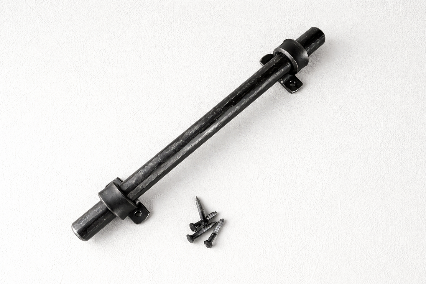 handcrafted black iron door handle close up