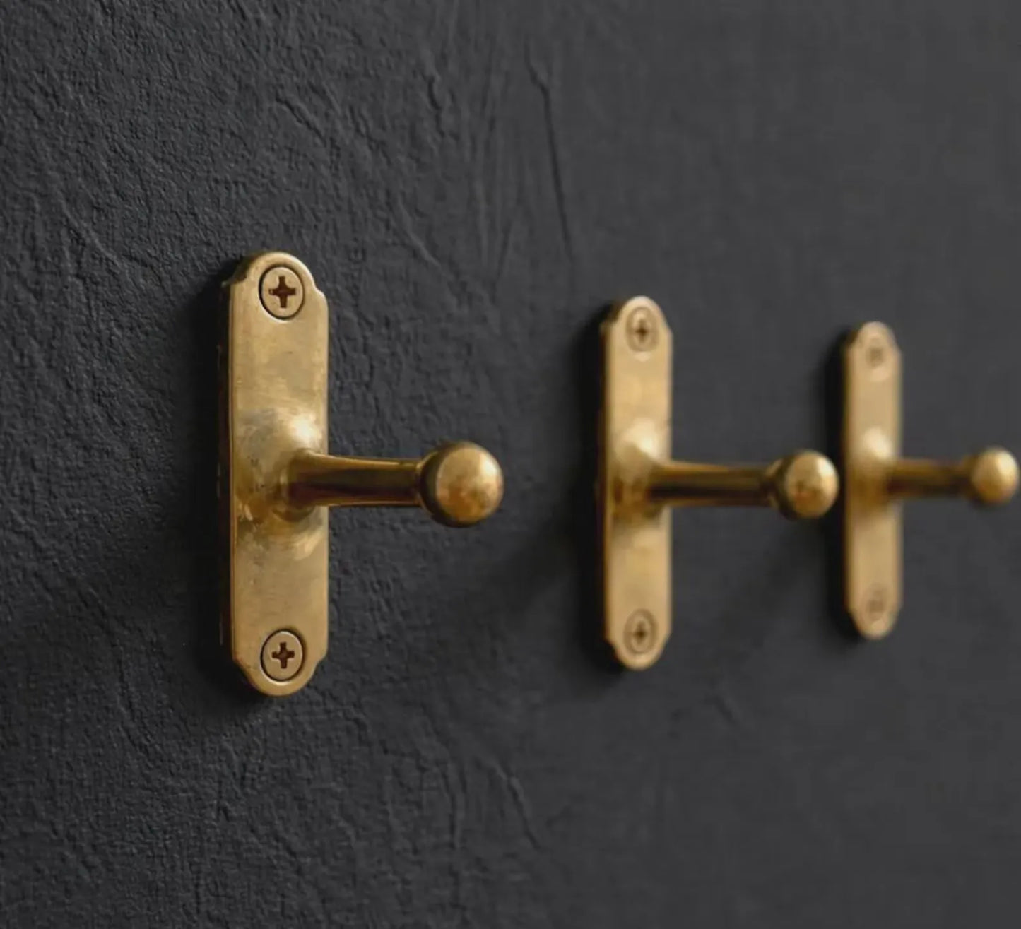 vintage brass wall hook close up detail