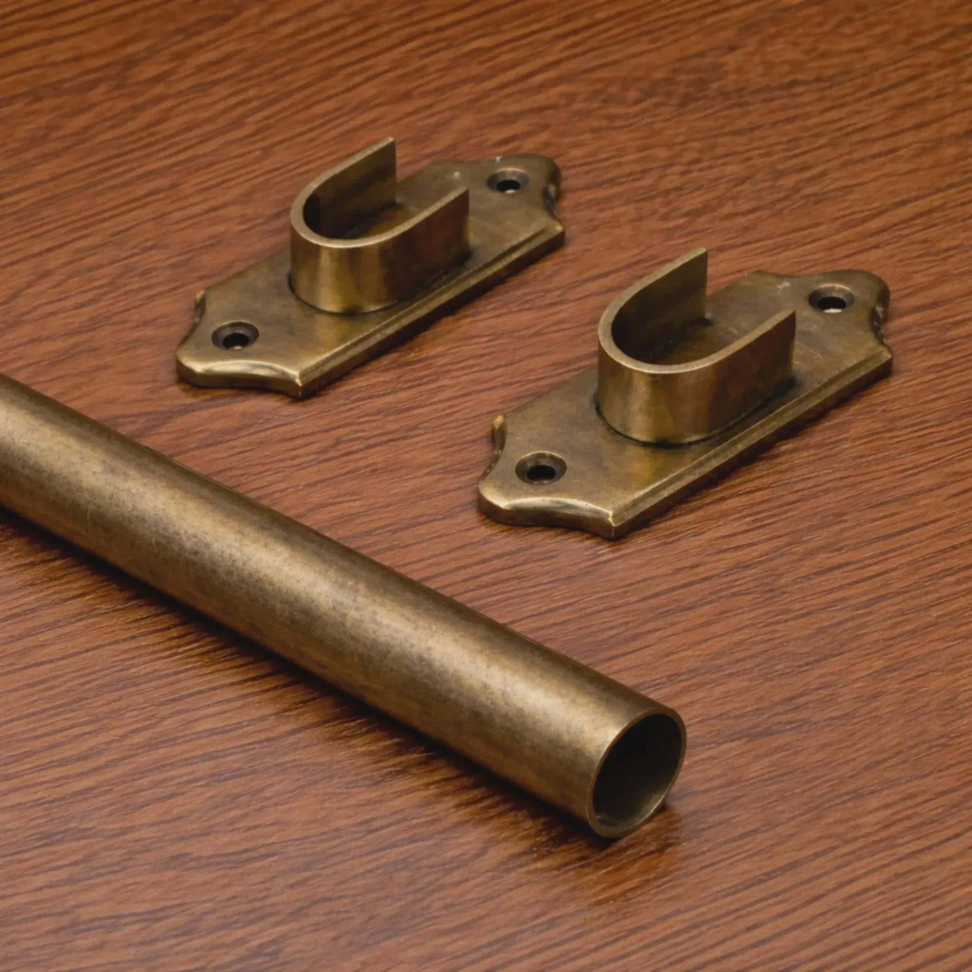 custom brass curtain rod with rings installed