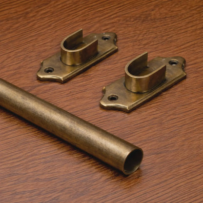 custom brass curtain rod with rings installed