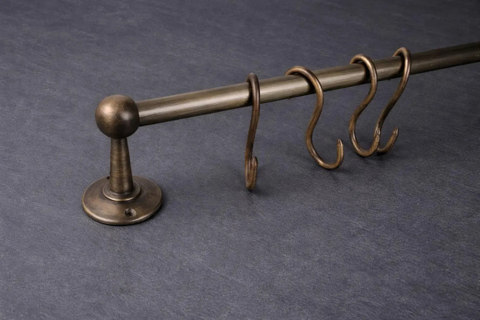 unlacquered brass pot rail close up detail