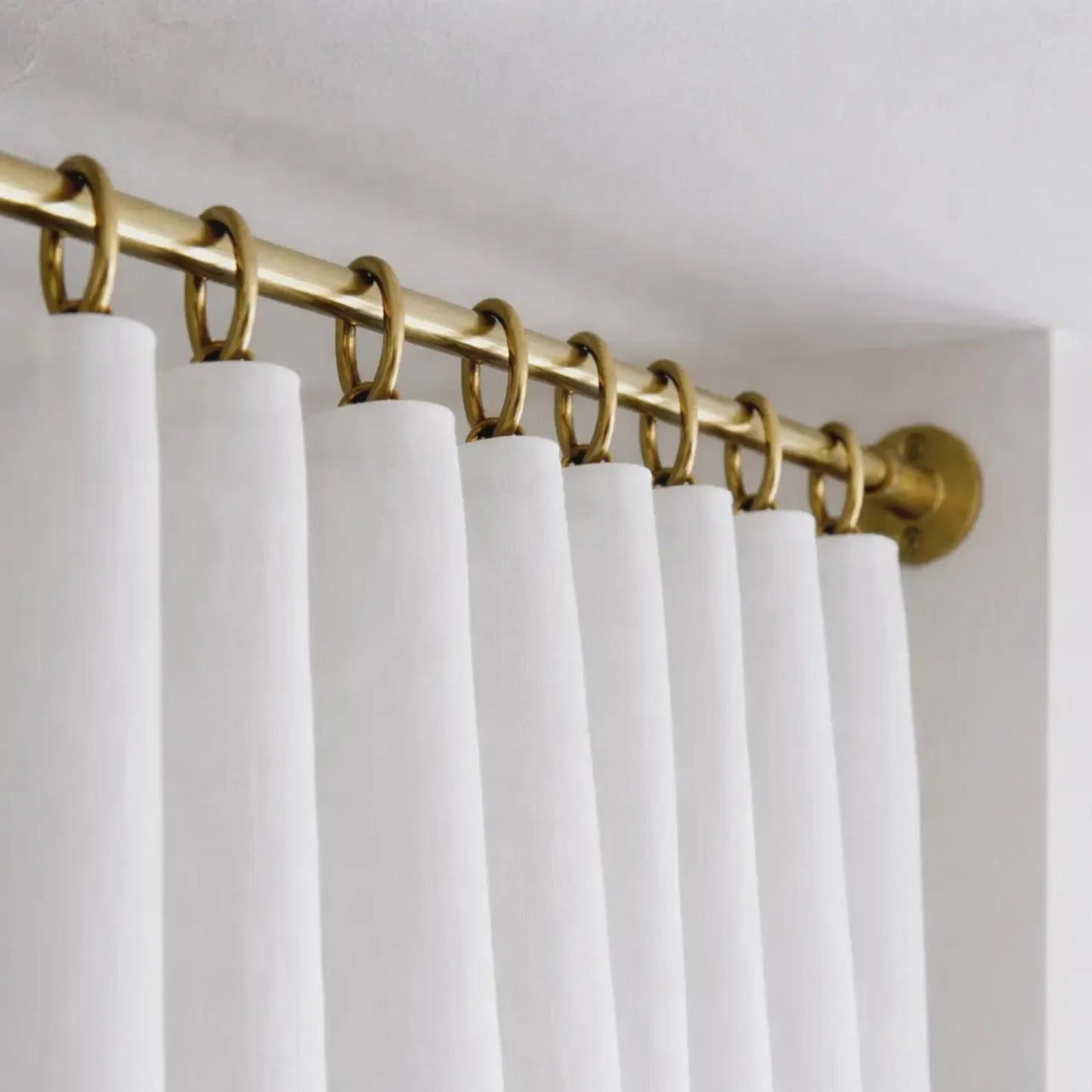 brass shower curtain rod hanger close up detail