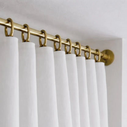 brass shower curtain rod hanger close up detail