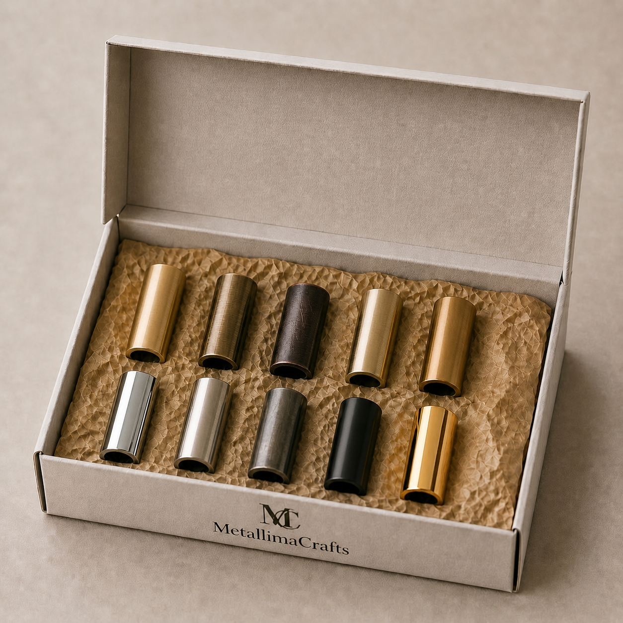 Set of metallic tubes in a box with 'MetallimaCrafts' branding.