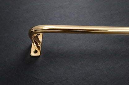slim brass curtain rod with linen curtains