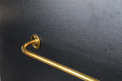 french return brass curtain rod close up