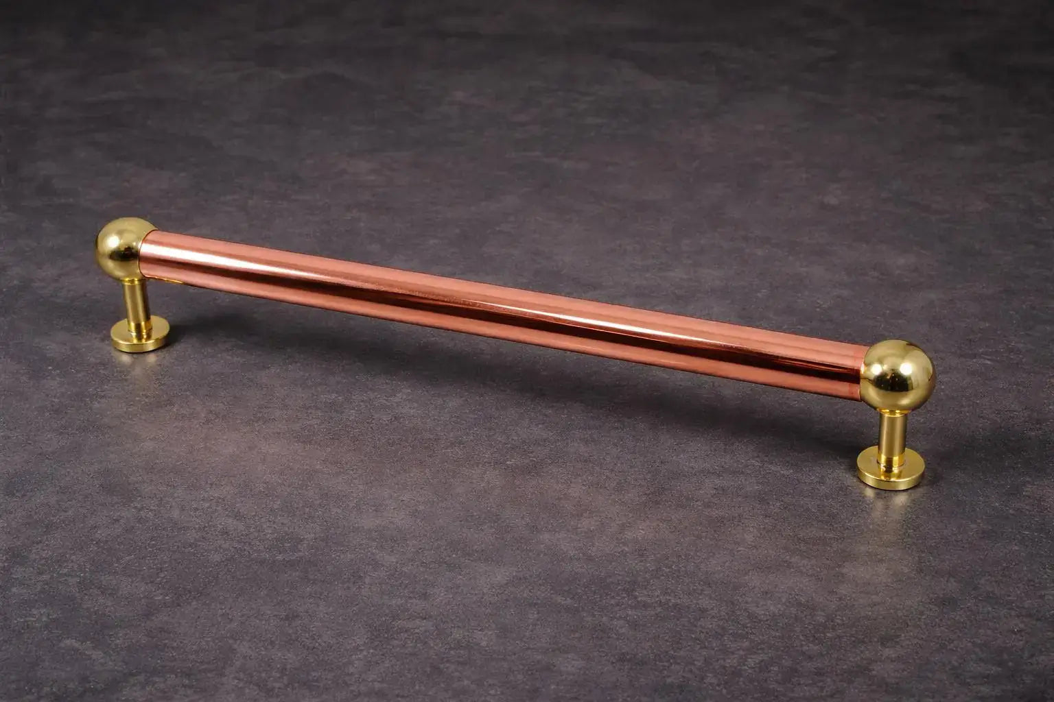 copper towel hanger with brass brackets