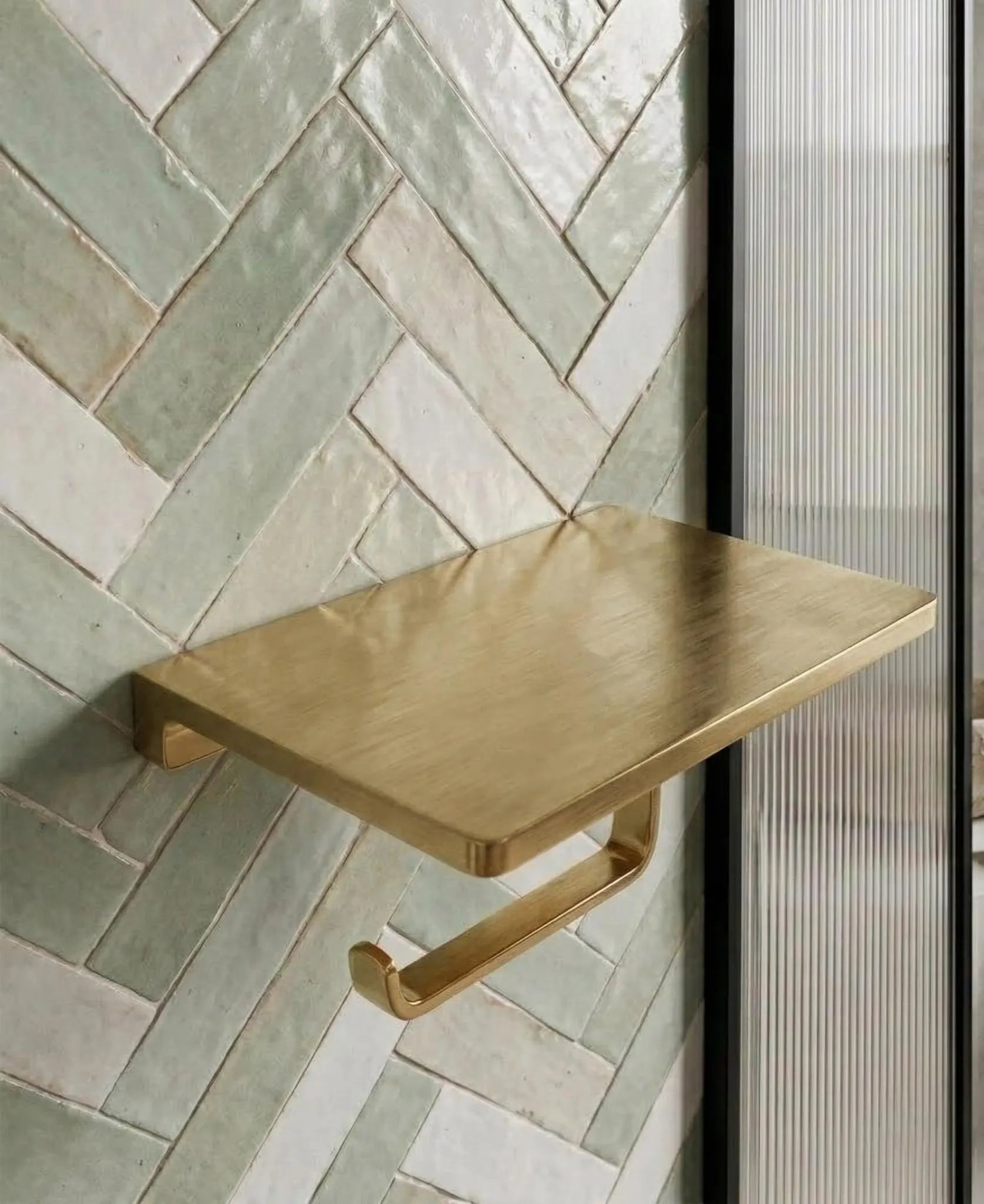 brass toilet paper holder modern interior